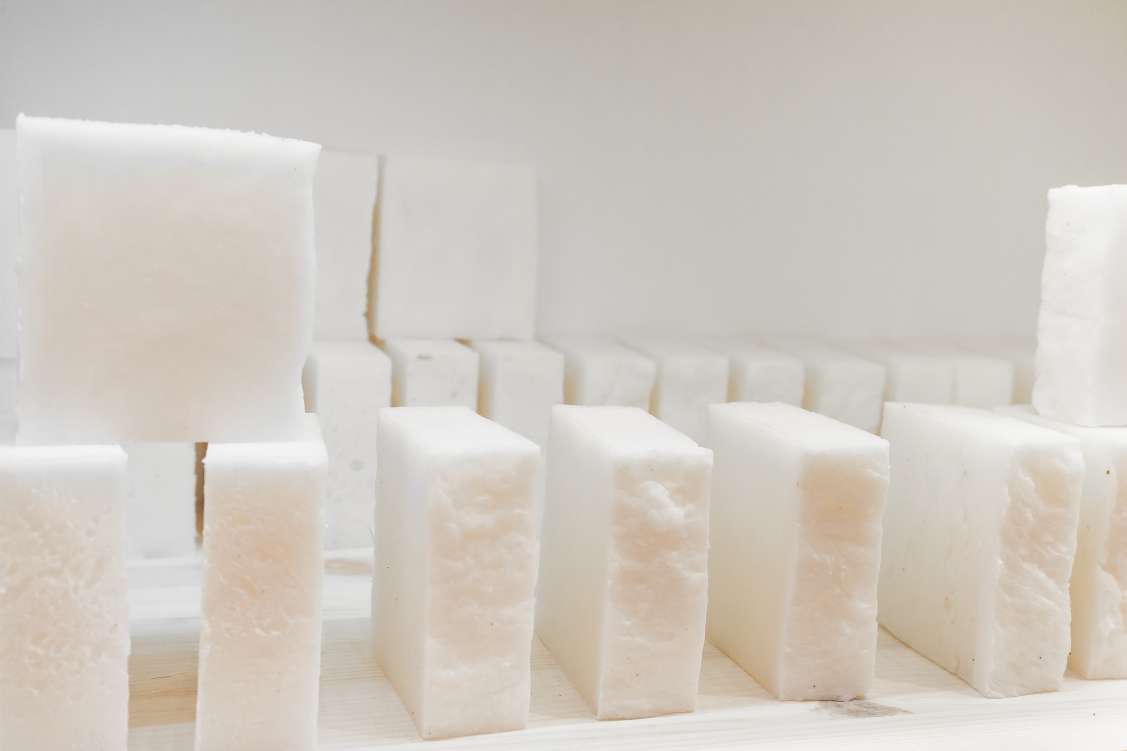 Bars of soap on a shop window. Pure natural soap with cedar oil and herbal ingredients. Handmade natural cold process soap. Eco-friendly exfoliating soap for hair and body